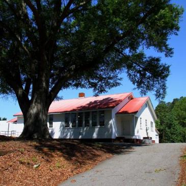 Once the Caldwell Rosenwald School, this building on Sam Furr Road is now home to the Burgess Supply Company, a carpet store. (Tom Bullock/WFAE)