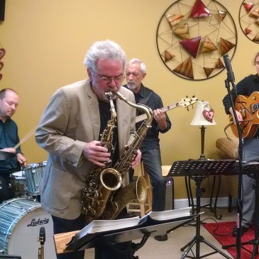 John Alexander played two saxophones at Heart 2 Heart Bakery in Cornelius on Sept. 27 with his band, Big Octave. From left are drummer Chris Garges, Alexander, bassist Ron Brendle and guitarist Troy Conn. (David Boraks photo)