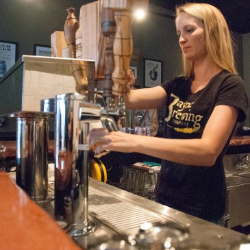 Kelly Bayne poured samples of beer at Bayne Brewing in Cornelius. (David Boraks photo)