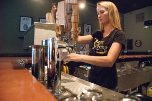 Kelly Bayne poured samples of beer at Bayne Brewing in Cornelius. (David Boraks photo)