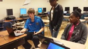 At a session in January 2014, E2D volunteers handed out computers to students at W.A. Hough High School in Cornelius. (E2D photo) 