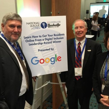 E2D President Pat Millen (left), Davidson Mayor John Woods and E2D board member Lisa Combs accepted the award at the National League of Cities meeting in Nashville Nov. 5.