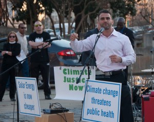 Osama Islibi of the Islamic Society of North America spoke at the rally about how he is installing solar at his house and at his mosque. (David Boraks/WFAE)