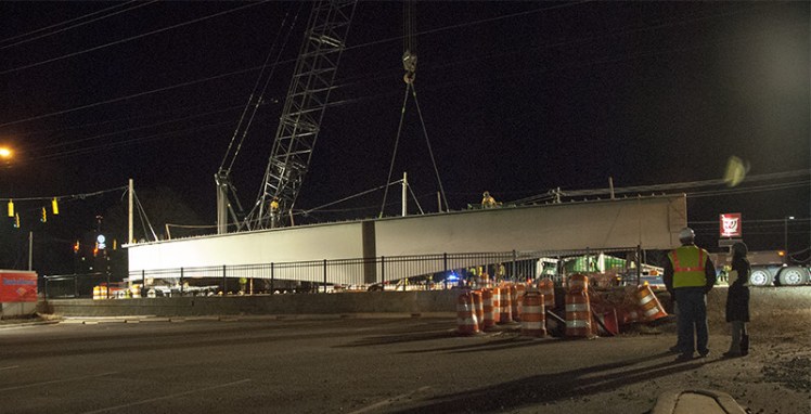 Workers prepared to move a girder Thursday night, Feb. 12, 2016, on the Blue Line extension at Harris Boulevard and North Tryon Street. (David Boraks photo)
