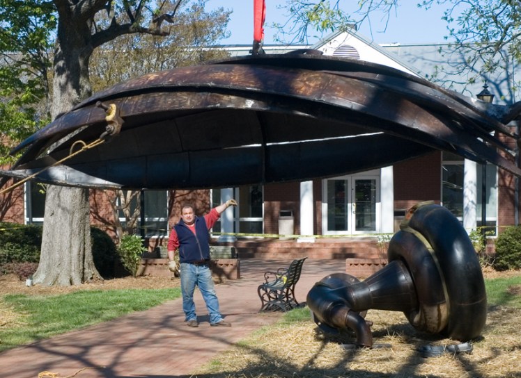 Andrew Dunnill installs "A Bouquet for Davidson" in 2009. (David Boraks/DavidsonNews.net)
