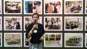 Current publisher Ann Caulkins spoke during Thursday's reception, in front of a wall of old photos. (David Boraks photo)