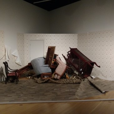 "Slow Room" by Jonathan Schipper is slowing being pulled together by a winch behind the wall.