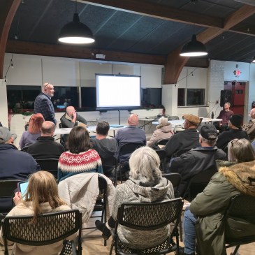 Crowd listens to an NCDOT consultant as he talks about the Potts-Sloan-Beaty road project at Ada Jenkins Center.